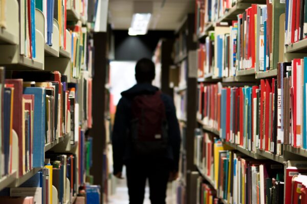 student in library