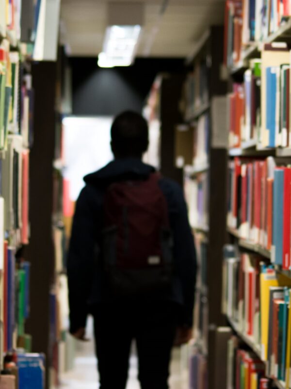 student in library