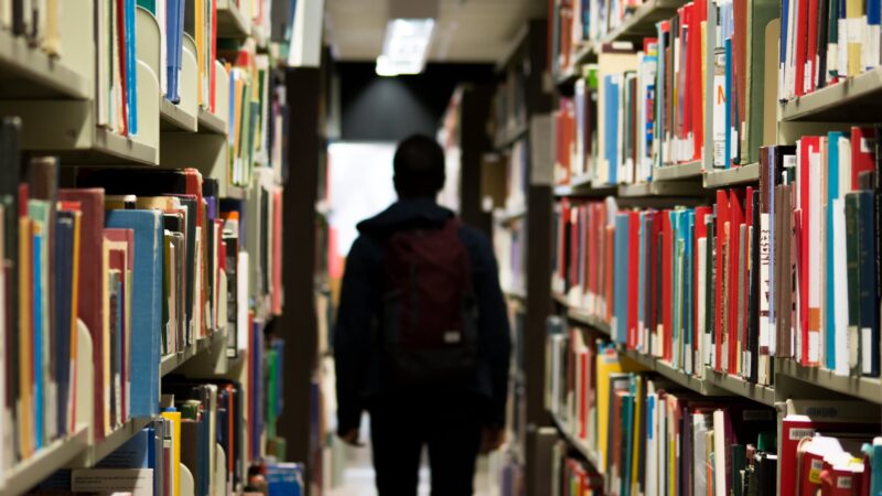 student in library