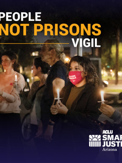 People holding vigil candles at the Arizona State Capitol