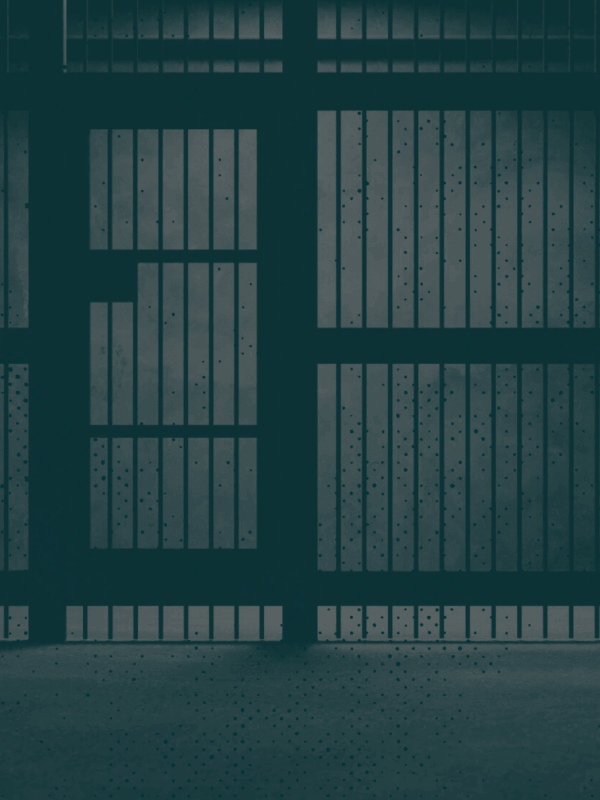 Image of jail cell with a green monochromatic overlay.