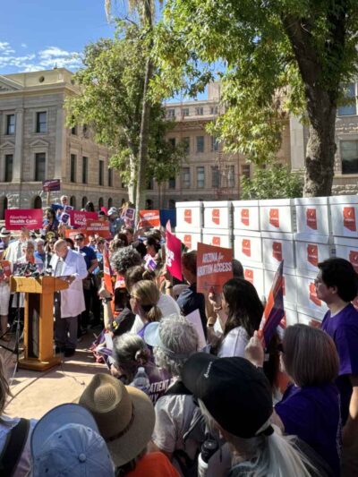 Advocates come together for a press conference and rally for Prop 139.