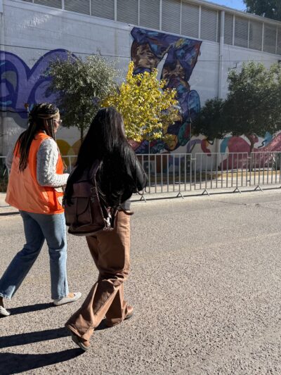 Yohana Oviedo, media coordinator of the Kino Border Initiative, and immigration attorney Marla Pacheco visit the government-run migrant shelter in Nogales, Sonora on Dec. 9.