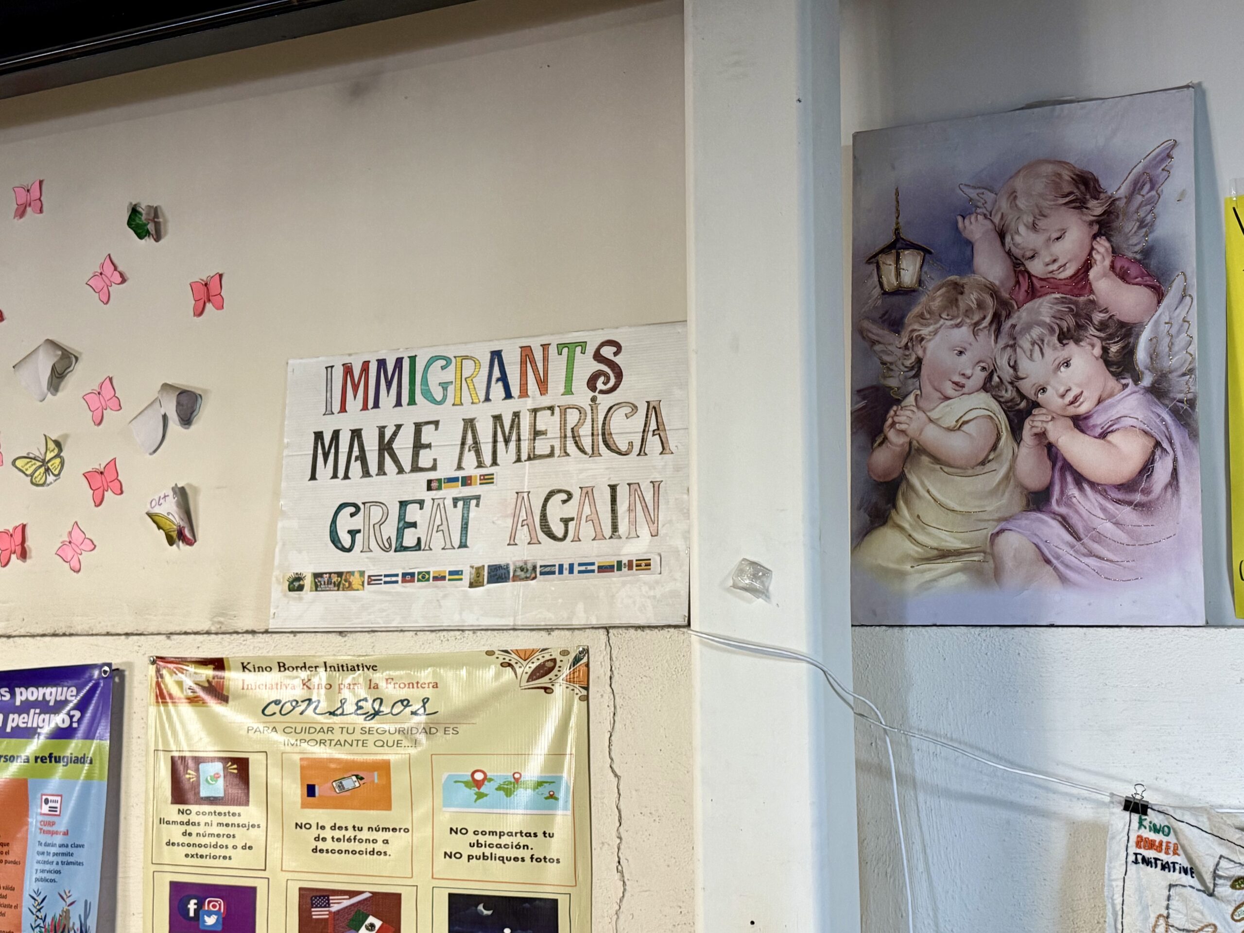 A handmade sign, hung inside Kino Border Initiative's migrant shelter, displays a wordplay on President Donald Trump's slogan "Make America Great Again."