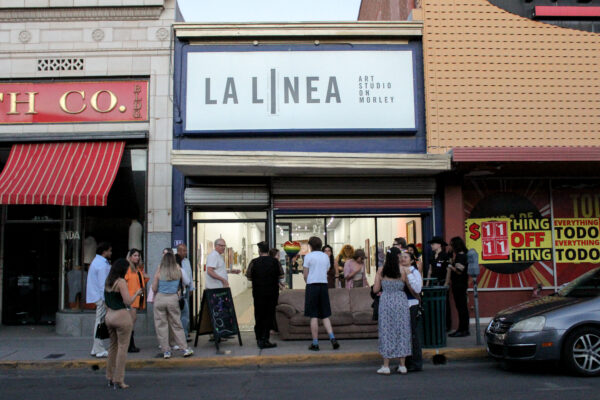 People gather at La Linea Art Studio in Nogales, Arizona.