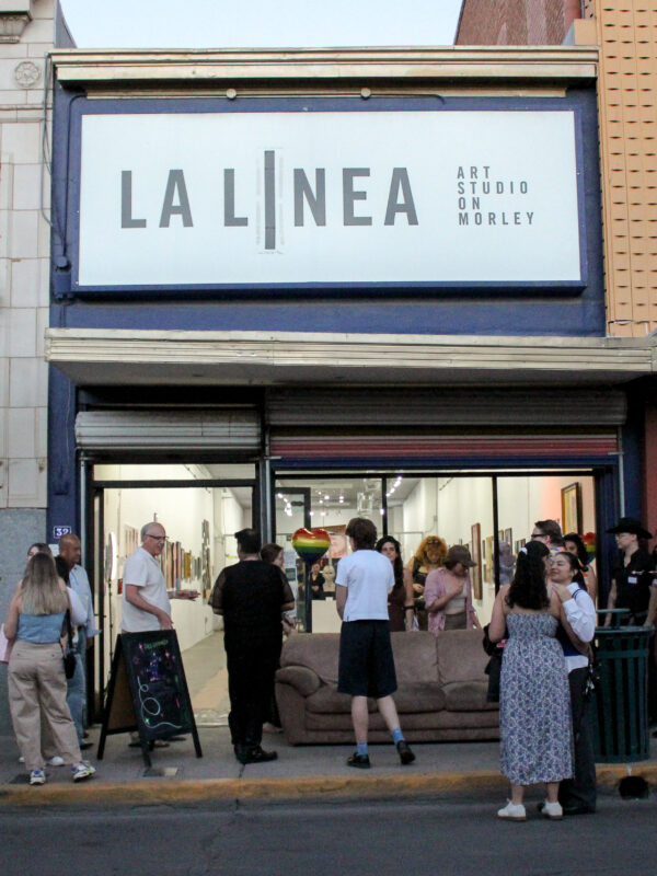 People gather at La Linea Art Studio in Nogales, Arizona.