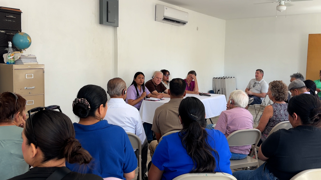 A woman speaks on a panel about her personal experience migrating to northern Mexico and the importance of treating migrant populations with dignity and respect.