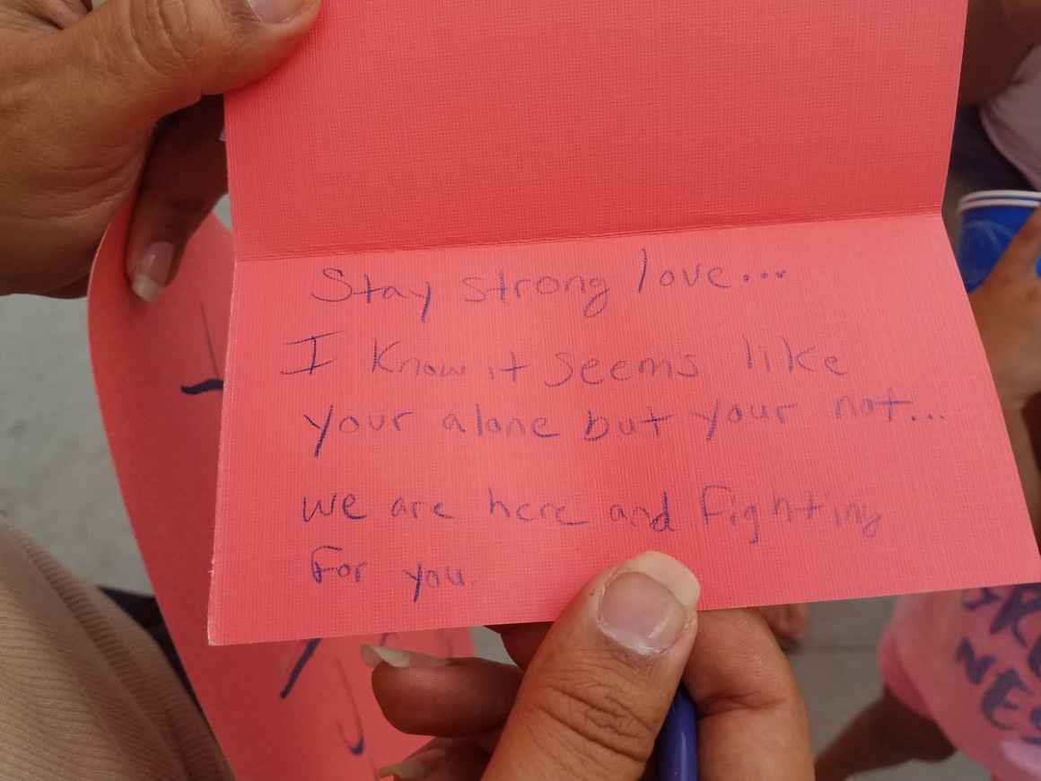 A supporter writes a note of encouragement to mothers trapped in the Fourth Avenue Jail in Downtown Phoenix. 
